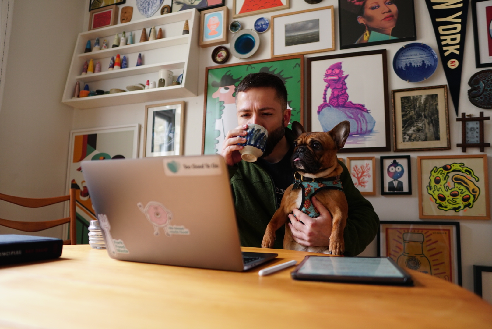 David O. Andersen at his desk with Hanx, his French bulldog